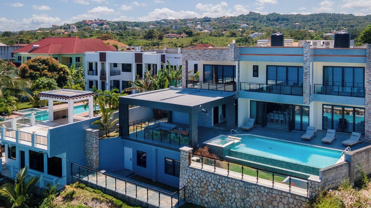 Epworth Villa | Luxury Oceanfront Villa~ Fully Staffed~Pool~Jacuzzi~Movie Theatre