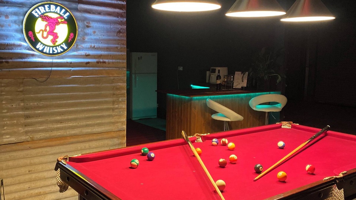 Mount Doran House | Man Cave with a touch of Lux. and an open fire.