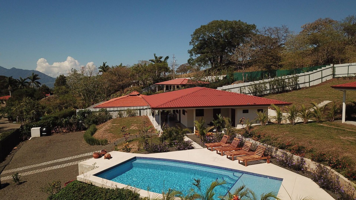 Escobal House | Mango Sunrise Retreat Modern 3-Bedroom House AC Mountain Views Saltwater Pool