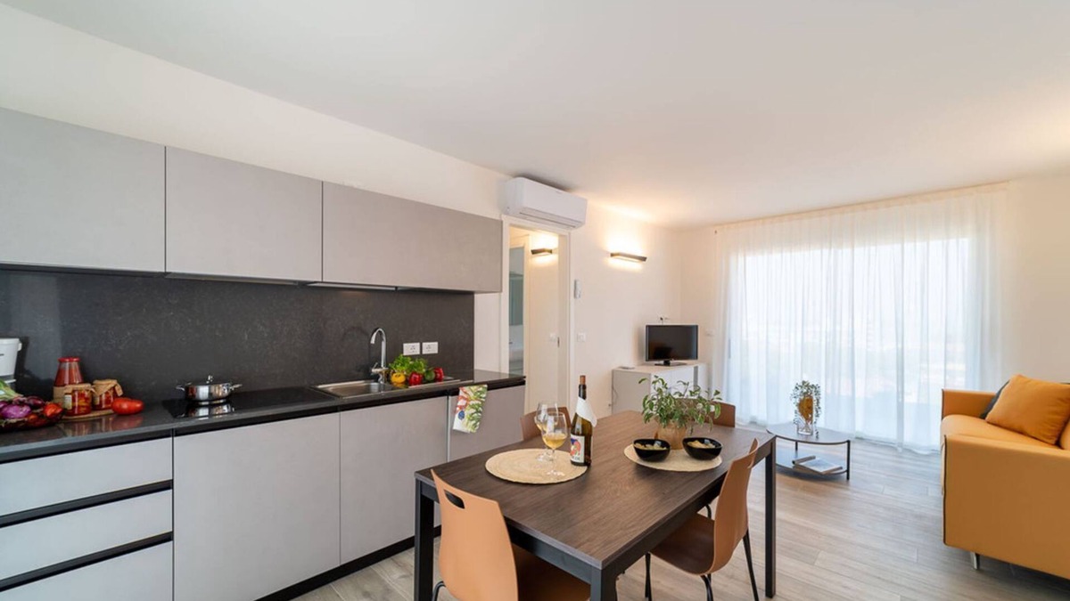 Lignano Sabbiadoro Apartment | Modern apartment with solarium and panoramic lagoon and seaview