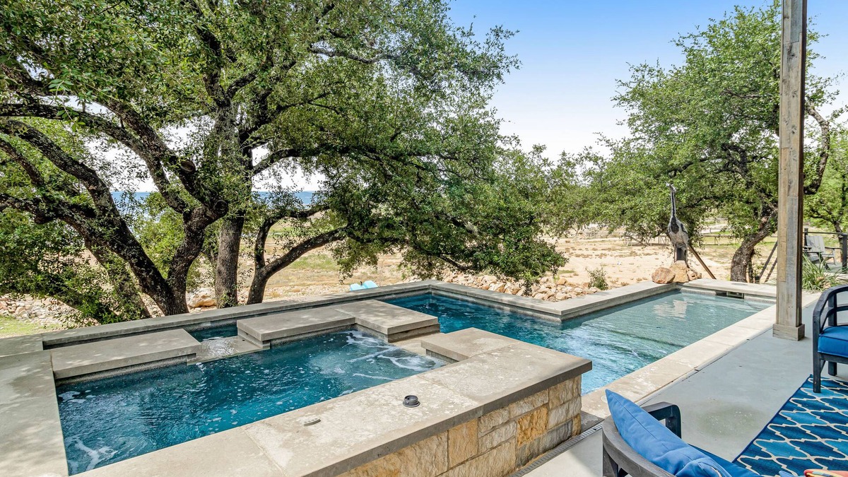 Burnet House | Modern charmer with gleaming lake views, pool, fireplace, & grill - dog-friendly