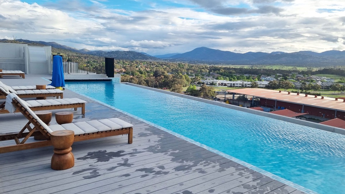 Greenway Apartment | Modern designer gem with access to complex pool, spa, sauna and rooftop park.