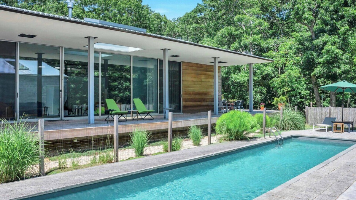 Springs House | Modern home sited on a lush wood acre, stunning pool, covered deck, outdoor.