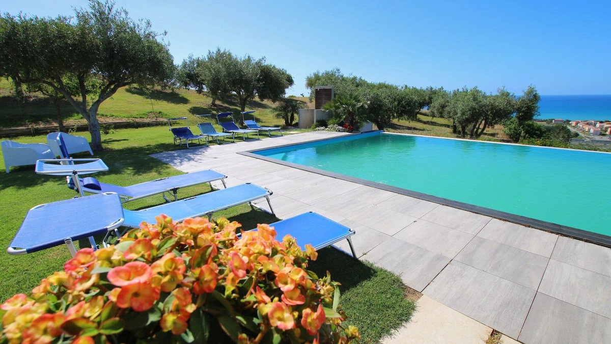Campofelice di Roccella Villa | Modern Villa with Private Golf Practice, Pool, Garden, Terrace, Wi-Fi, Sea View