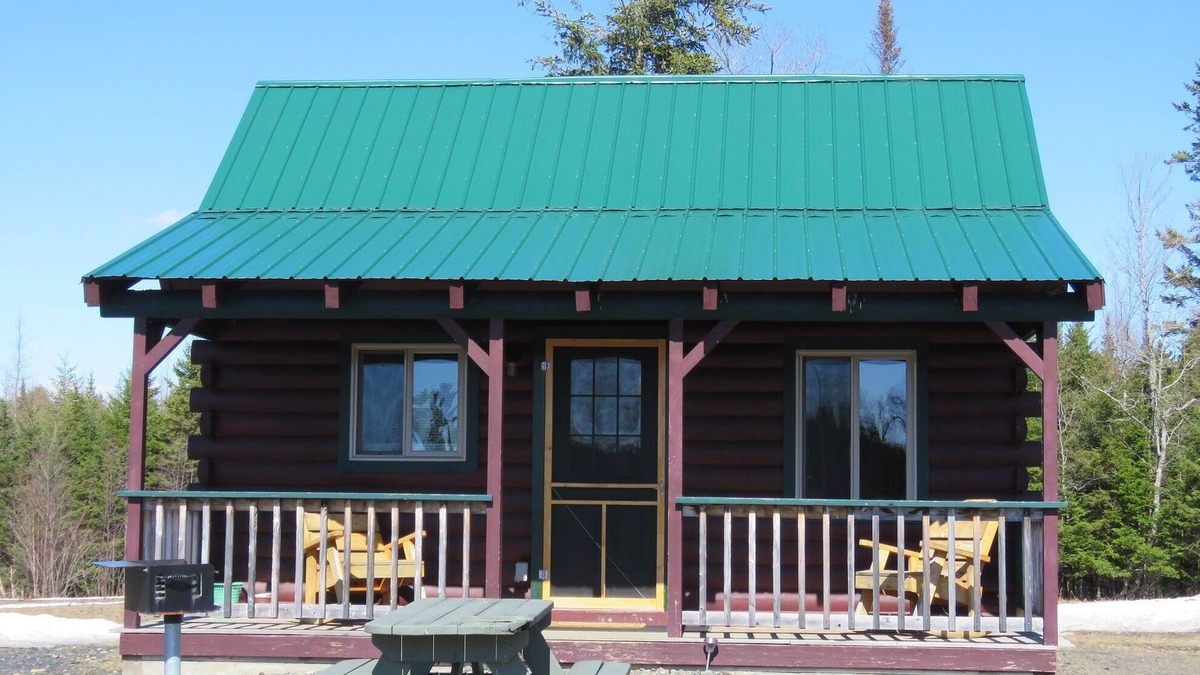 East Corinth Cabin | Modern log cabin with pond view available for rent in middle Maine.