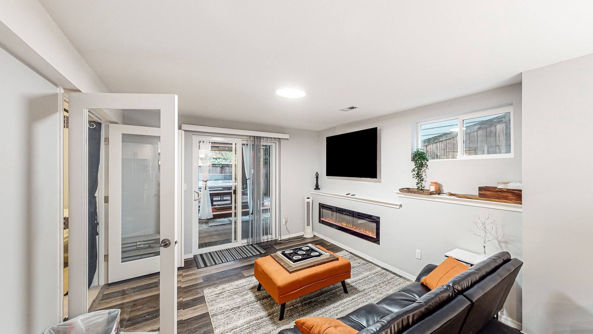 The Wedge House | Modern lower-level getaway with a fireplace, inviting patio & washer/dryer