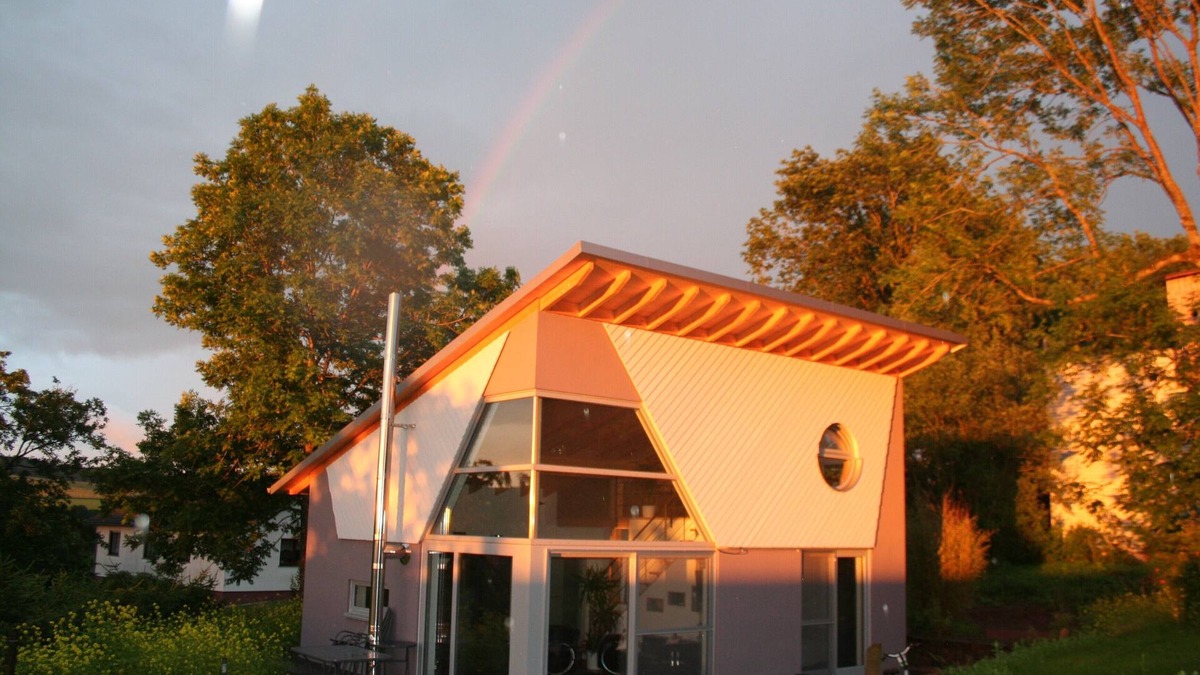 Roth House | Modern, panoramic windows with views of nature, fireplace, sauna