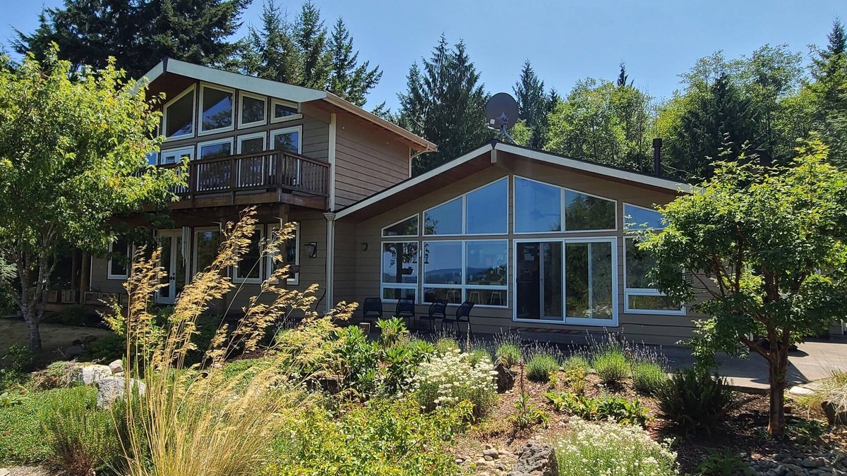 Hamma Hamma House | Modern retreat with serene canal, forest, and mountain views.