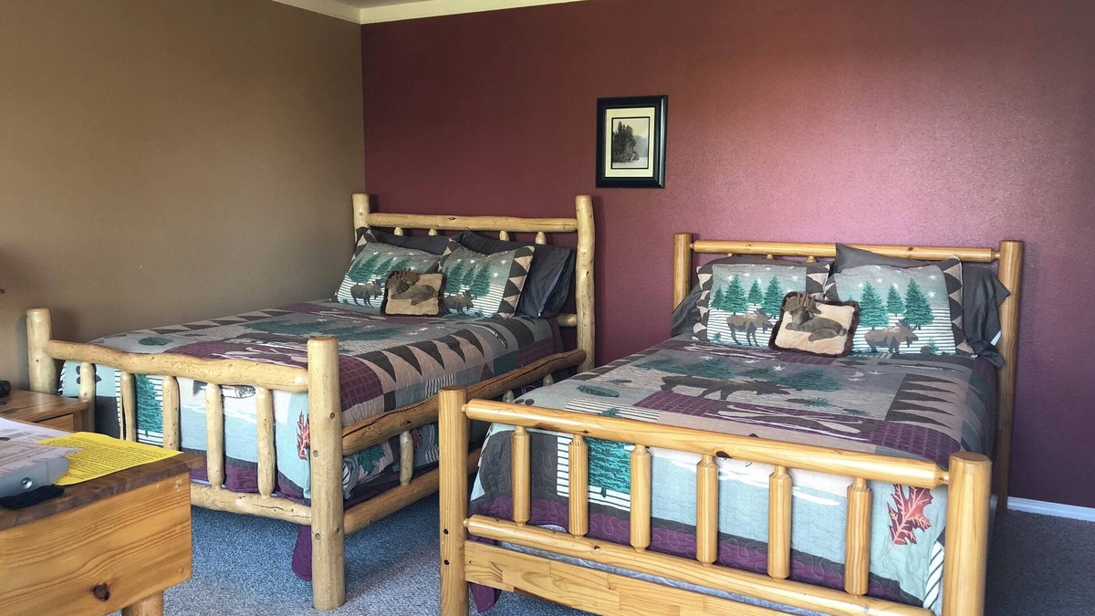 Cohoe Hotel | Moose Is Inn Room 2- Two double beds with a balcony view