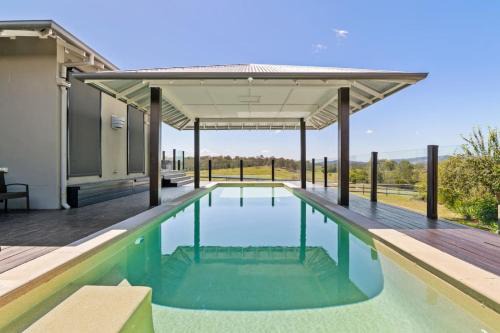 Tamborine House | Mountain Majesty with Poolside Relaxing Getaway