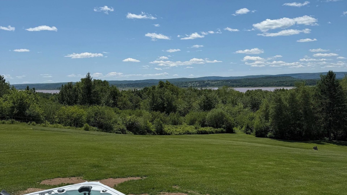 Memramcook House | Muddy River Retreat - Private backyard with Hot tub