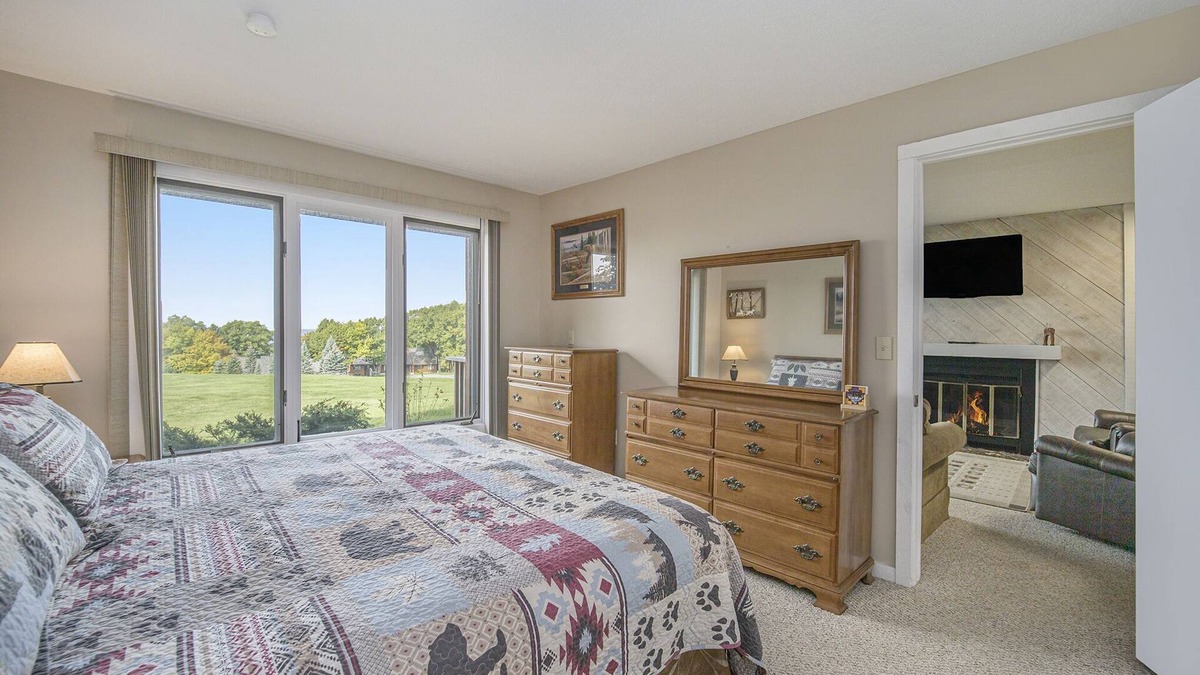Bellaire Condo | New! Cozy Condo w/Fireplace & Lake Views at Summit Village