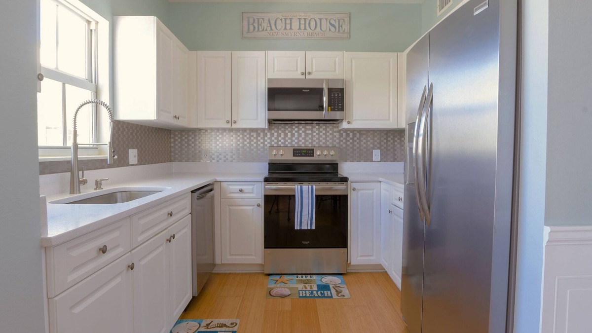 New Smyrna Beach Condo | *New Listing* Luxury Courtyard Condo! Walk to Beach/Restaurants/Shops. Free WiFi