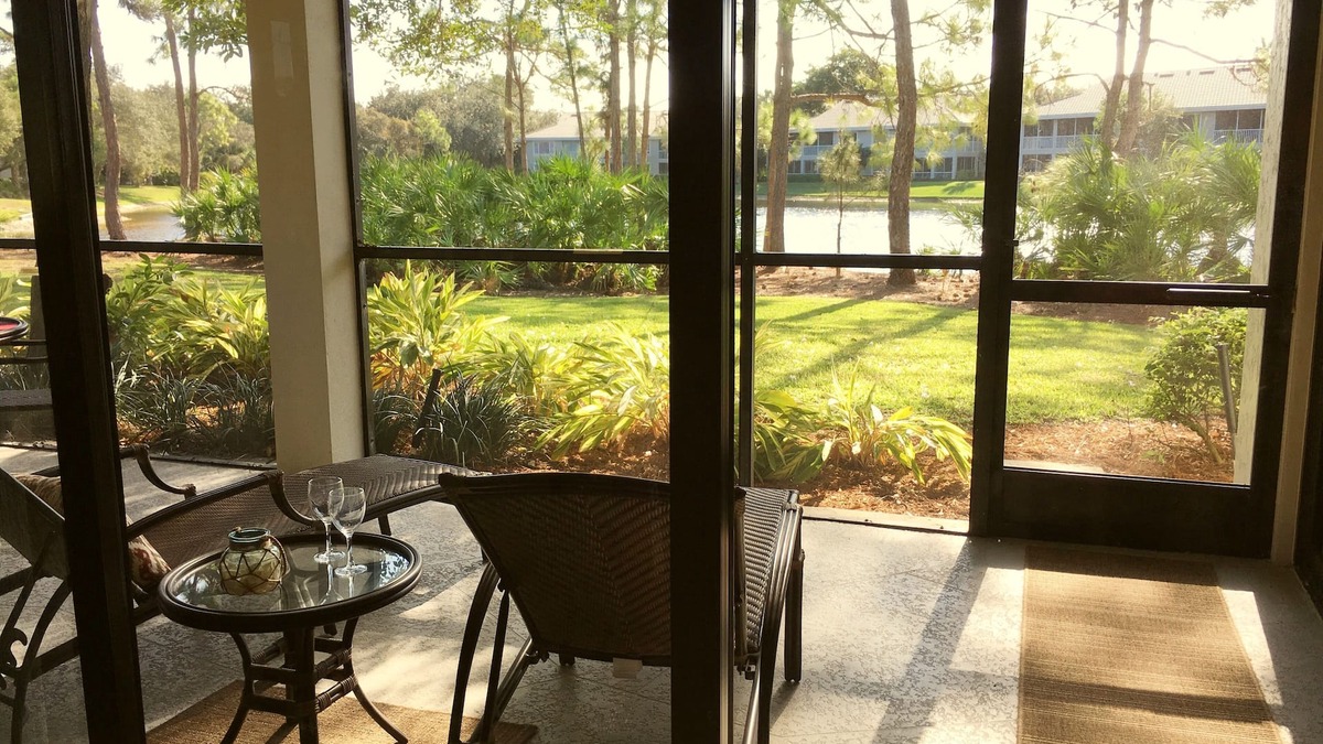 Bonita Bay Condo | Newly Renovated Corner Unit. Lake Views. Shuttle to Beach. Heated Pool/Spa