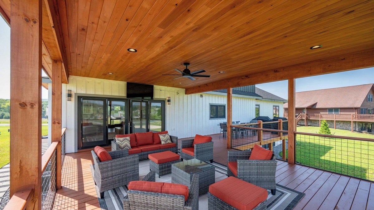 Waterfront Greens House | Night & Day: Lake Access, Hot Tub!