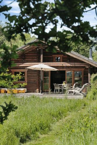 Øster Melholt House | Nordic Log Cabin With Views Over The Fields