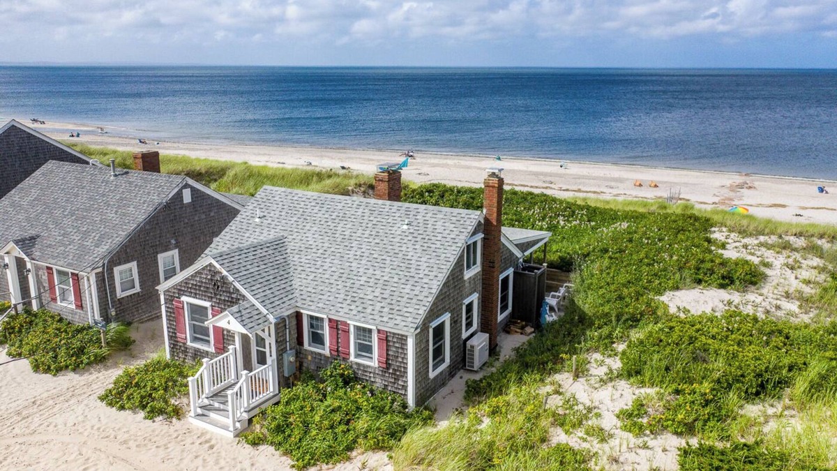 East Sandwich Cottage | Ocean front oasis nestled into the dune on a private East Sandwich beach.