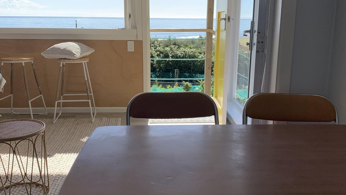 Cape Palliser House | Ocean views of the Kaikoura's and surf break. Private beach hut.