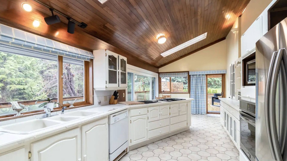 District of North Vancouver House | Oceanfront Cottage w/Rare pvt dock, hot tub, large backyard