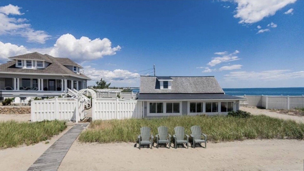 Adamsville Cottage | Oceanfront Cottage with Private Beach and Courtyard. Outside Bar & Fire Table.