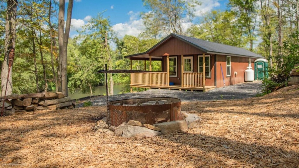 Mill Hall Cabin | Off grid; River front getaway, boat. Firepit, woodland; Generator. 2 Bedrooms.