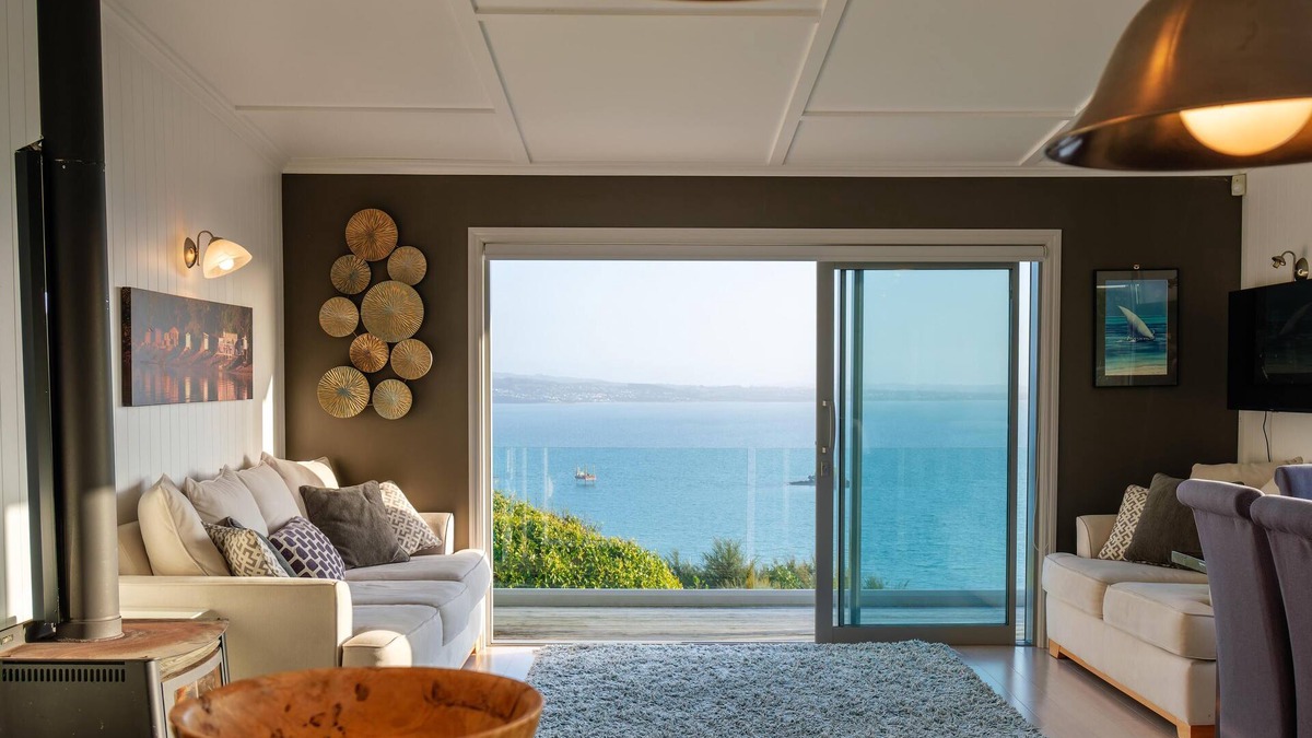 Omiha House | Ōmiha Oasis - Ōmiha Oasis is a premium family holiday home with spectacular views and wonderful amenities set in the tranquil surroundings of Ōmiha (Rocky Bay), Waiheke Island. The property has three bedrooms and two bathrooms, making it perfect for