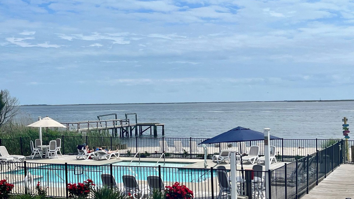 Southport Condo | On the picturesque SPT Waterfront! Beautiful Pool & Private Beach!