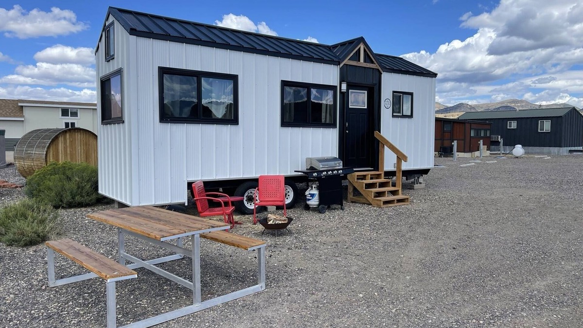 Meeker House | Our newest and one of our largest tiny homes contains a queen bed on the main level and two queen lofted beds. Sleeps: 6