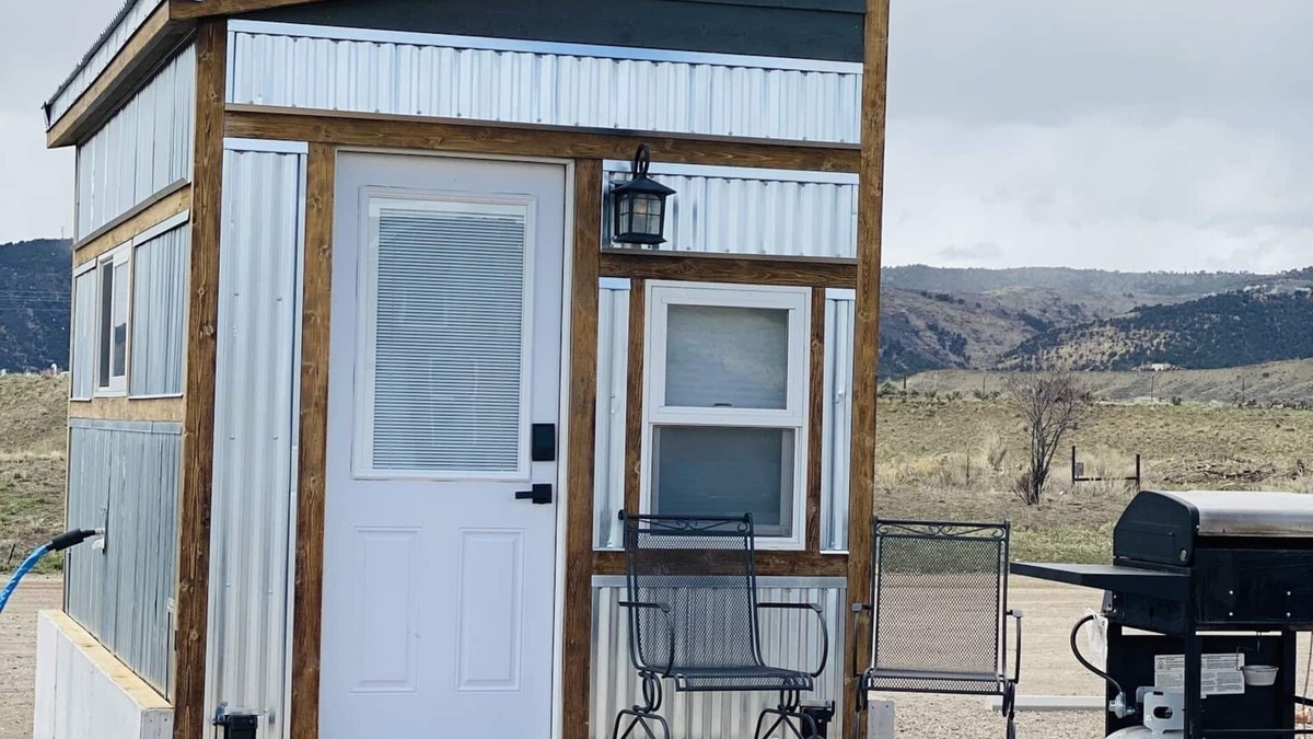 Meeker House | Our tiniest Tiny Home packs a punch! It contains a Queen bed in a loft accessed by a ladder. Sleeps: 2