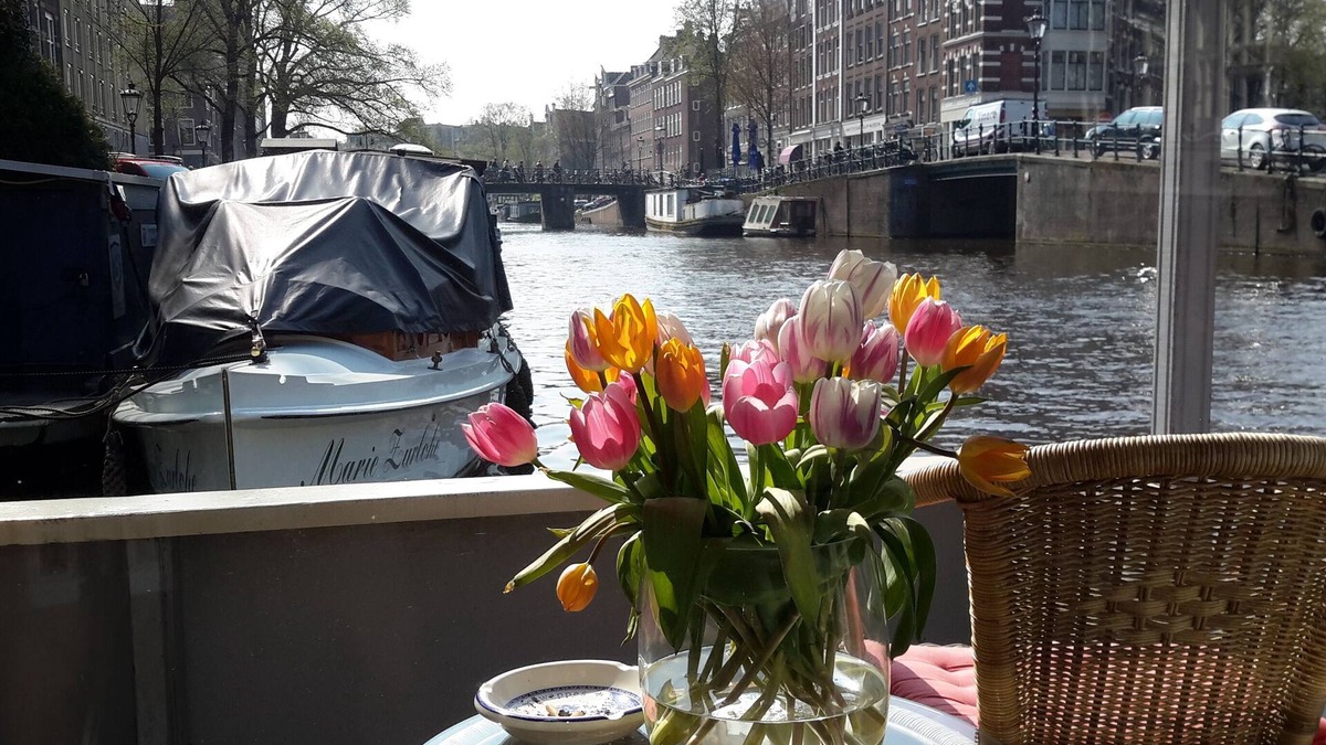 Grachtengordel-West Boat Rental | Pantheos Houseboat in Prinsengracht with a view of the Westerkerk the Landmark.