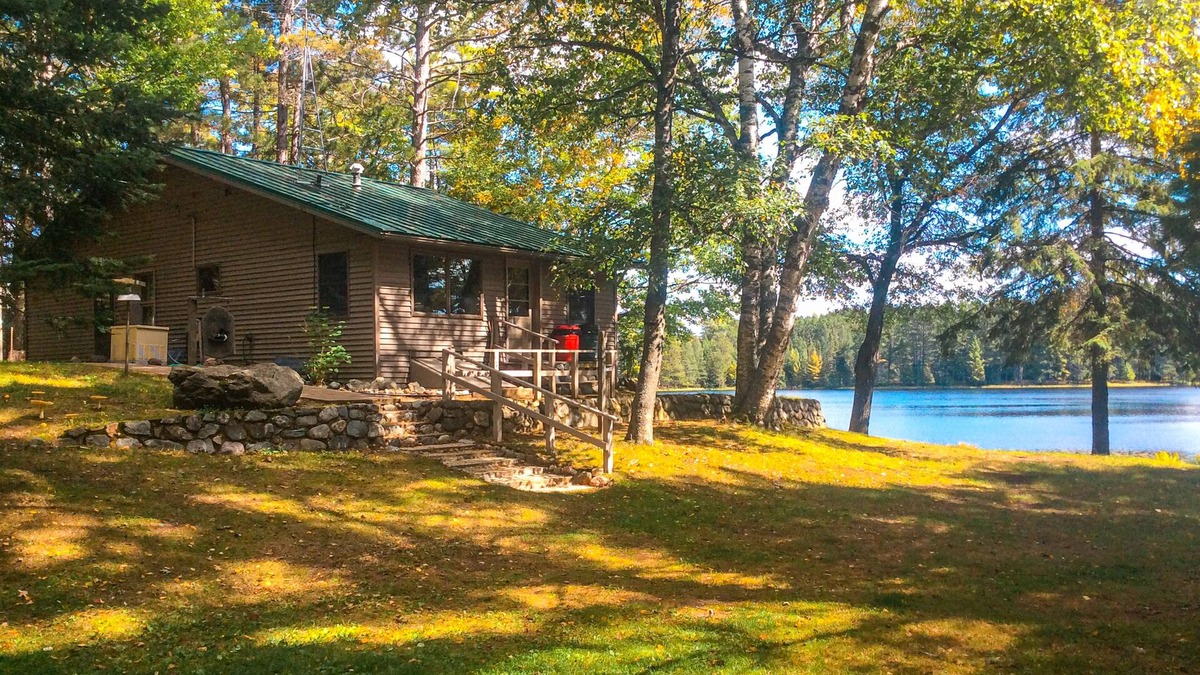 Rhinelander House | Peaceful, quiet lakefront dog-friendly cabin w/fishing dock, boats, campfire pit