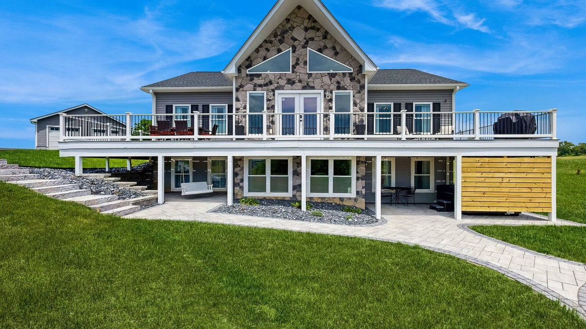 Orange House | Peaceful retreat with hot tub, fire pit, games, kayaks, and water view