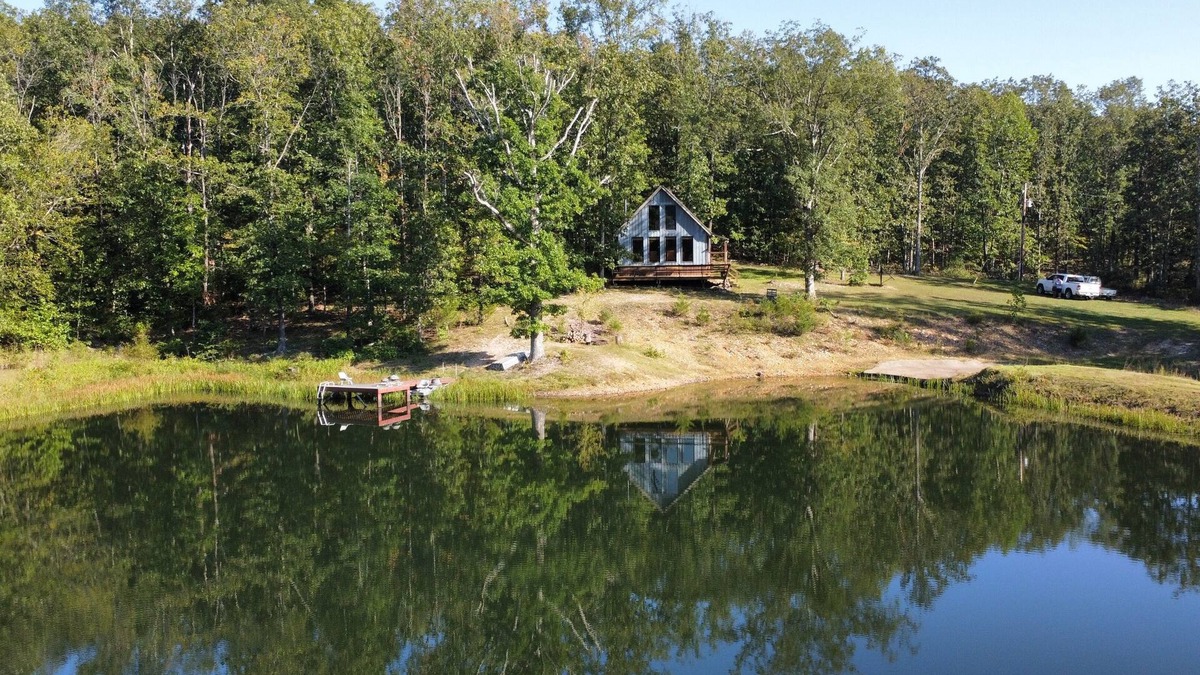 Elk Creek Cabin | Peaceful secluded cabin nestled on 40 wooded acres overlooking 4 acre pond.