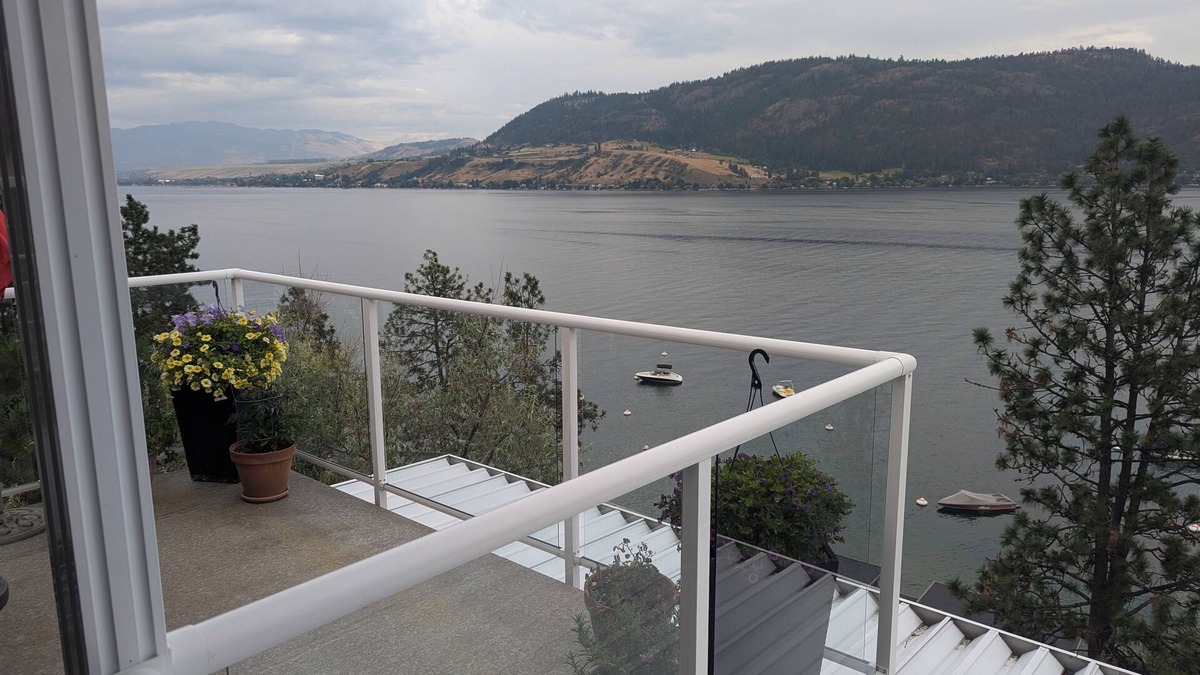 Adventure Bay Condo | Penthouse Condo with amazing OK lake and mountain views, private beach and dock.