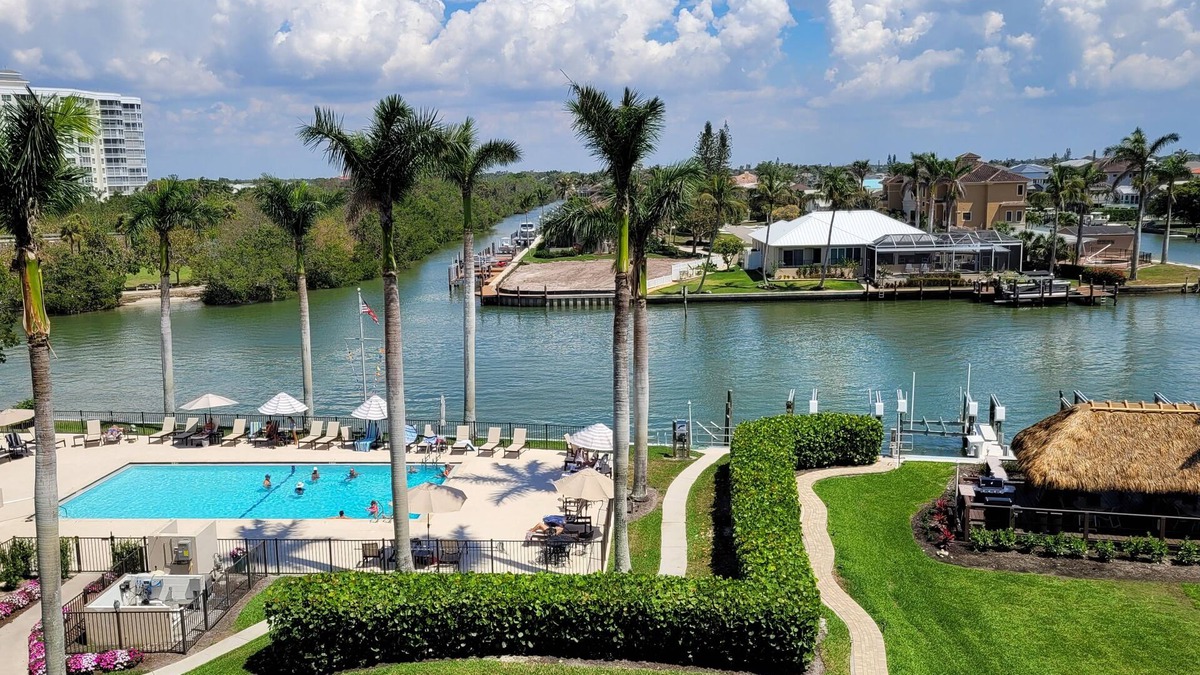 Vanderbilt Beach Condo | Perfect Location! On The Bay Direct View of Gulf! Wrap Around Lanai!