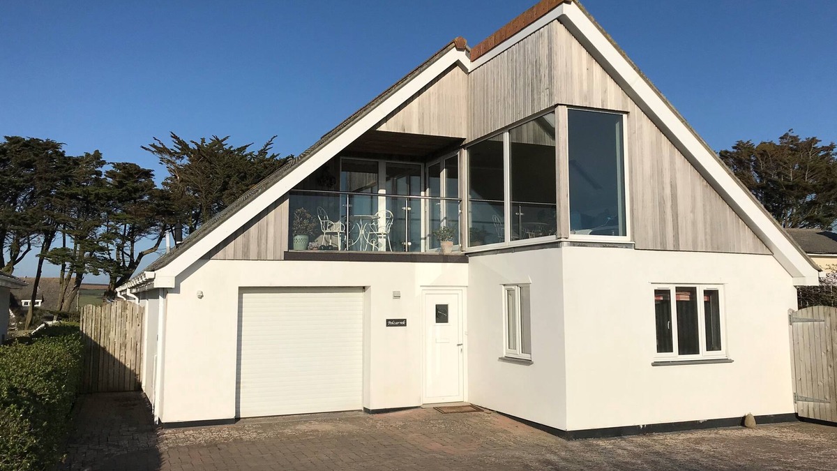 Trevone House | Polcarrek contemporary holiday home with parking and garden. Balcony with rural views