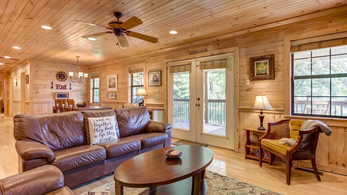 McCaysville Cabin | Pond-front cabin with private hot tub, fireplaces, furnished deck, & game room