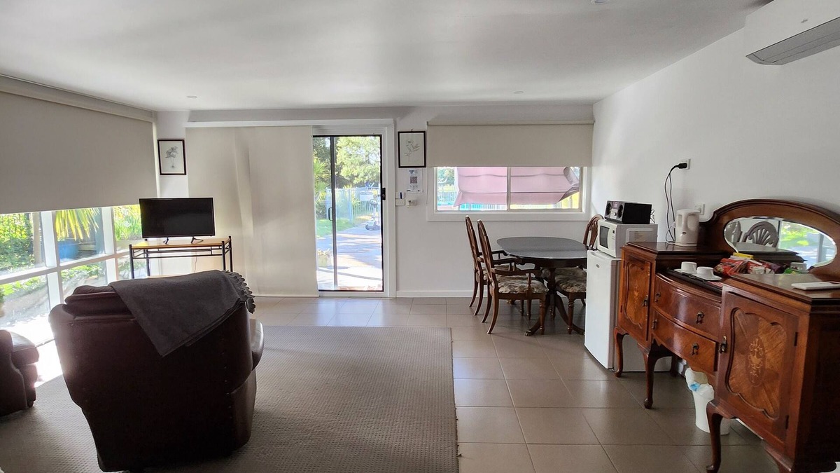 Kyneton Cottage | Pool room - tranquil spacious room with pool views.
