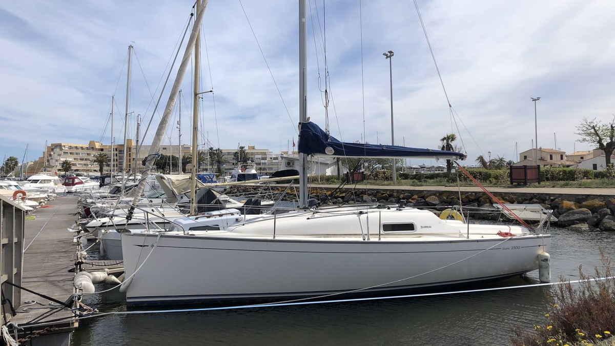 Naturist Village Boat Rental | Pretty sailboat at the quay on the quiet side of the naturist port