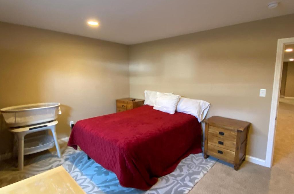 Maxwell House | Private basement bedroom with private bathroom, kitchen, and living room with large screen television