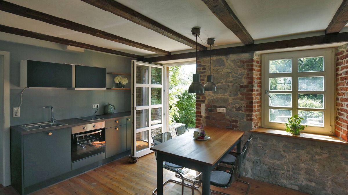Detmold House | Quaint apartment with fireplace and sauna