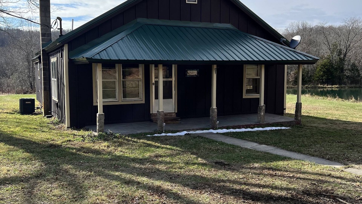 Black Other | Quaint farm house with a small fishing pond.