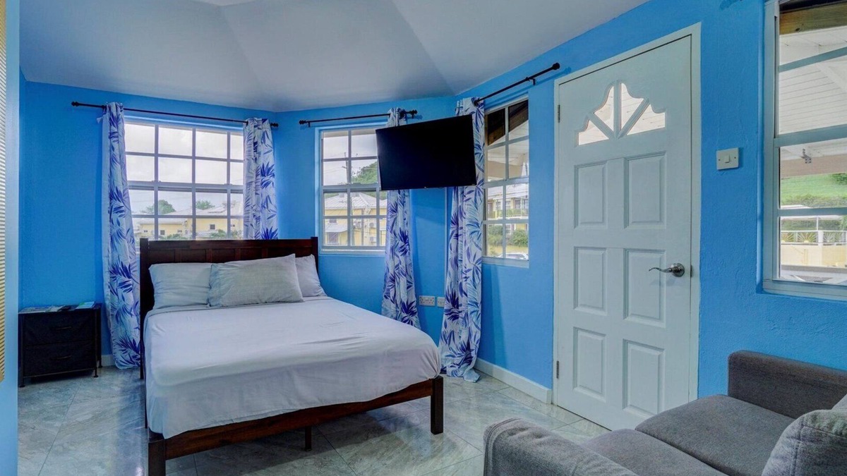 Calliste Apartment | Quaint one bedroom unit steps away from beach access
