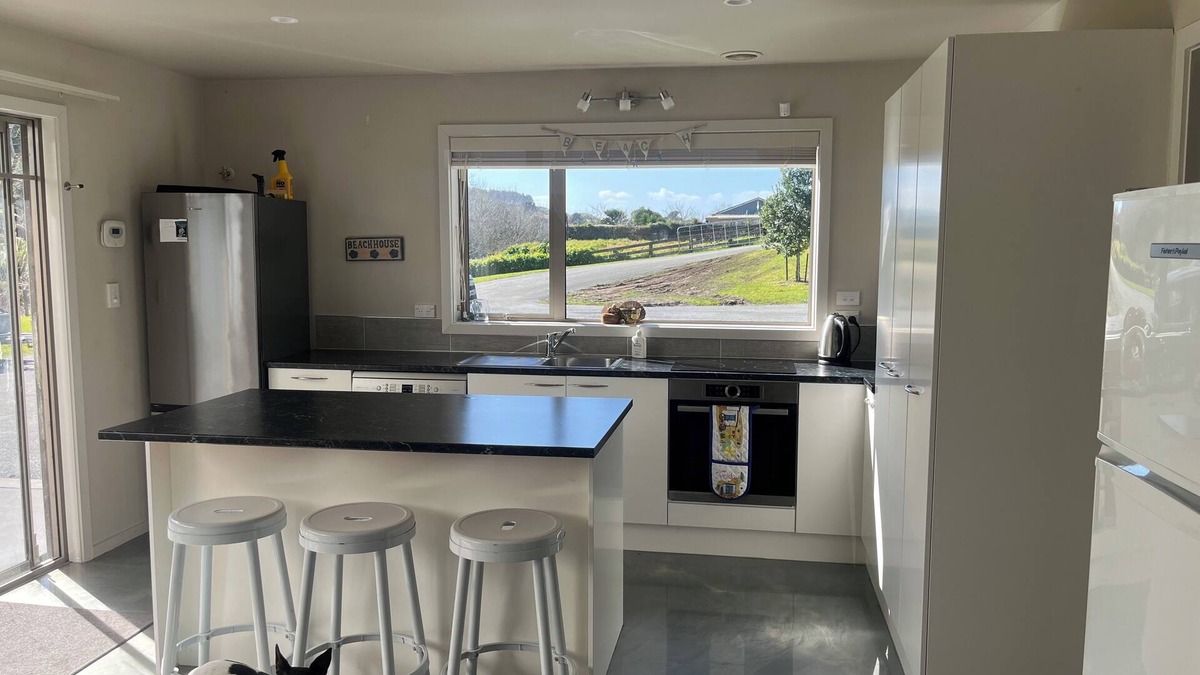Kawhia House | Quiet private bush out look but right in town. Perfect for boaties