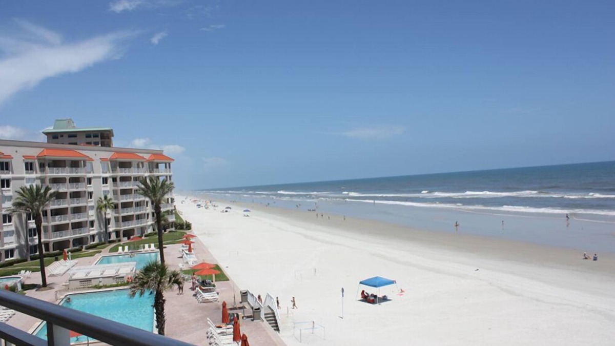 New Smyrna Beach Condo | Rare three bedroom end condo. Two bedrooms face the ocean with private balcony from Master bedroom.