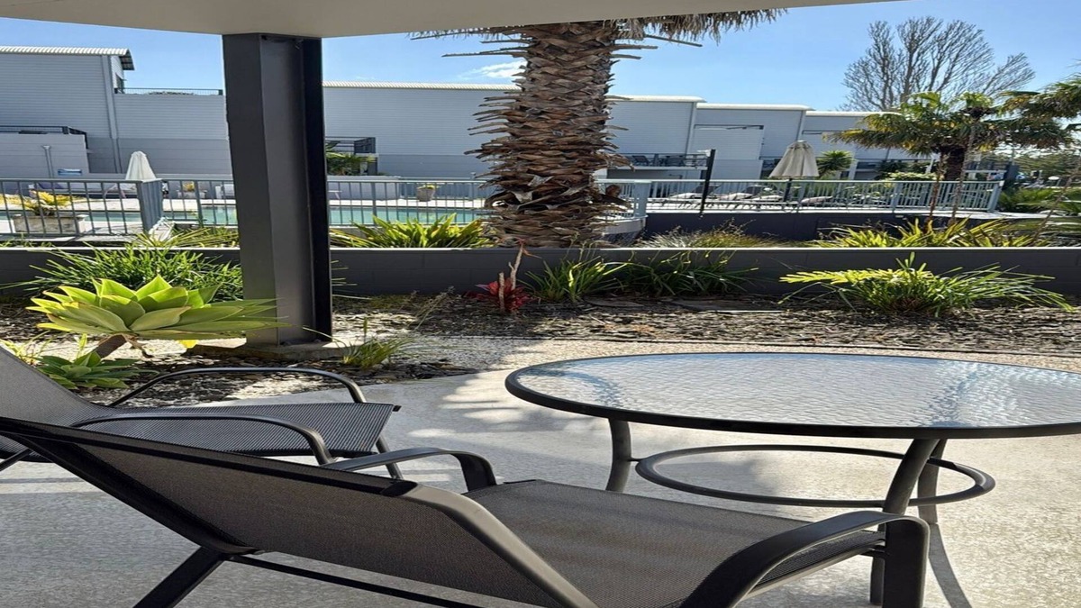 Batehaven Apartment | Relax by the Pool in This Stylish Batehaven Stay