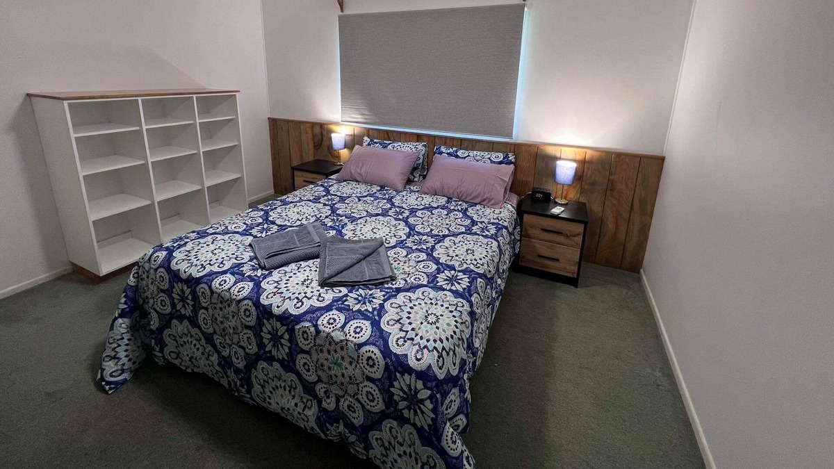 Burnt Pine Cottage | Relax in a 2 bedroom cottage a short walk from cafes, restaurants and shops