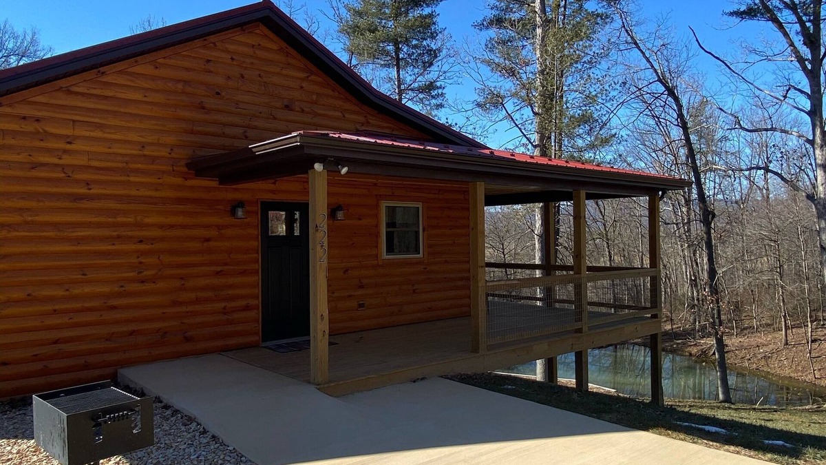 Stanley Cabin | Relax in our secluded hot tub overlooking the pond with a glass of wine
