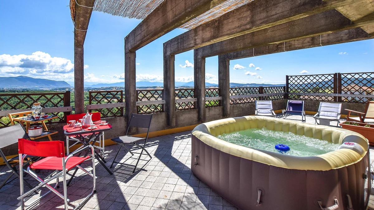 Avigliano Umbrio Apartment | Relax in the whirlpool with panoramic views of the Umbrian countryside.