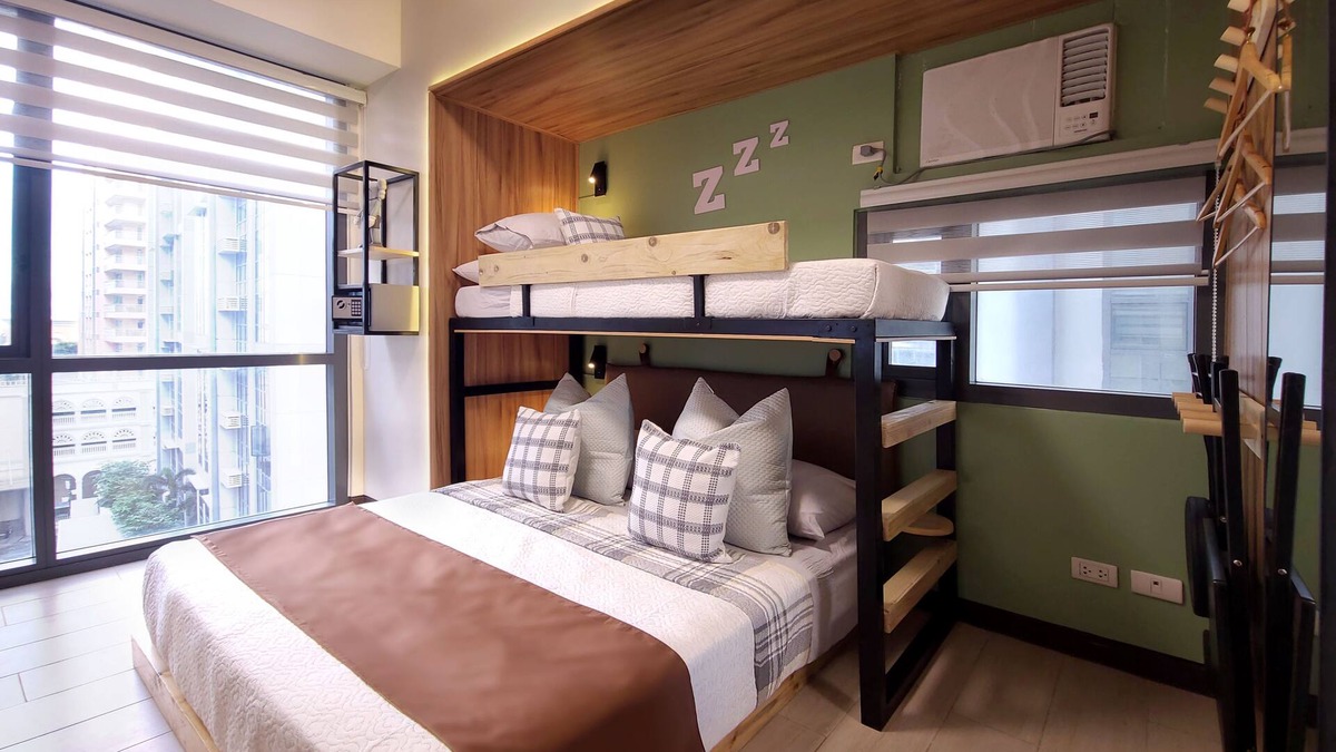 Bonifacio Global City Condo | Relax to a family size condo with fun games, popcorn and cinematic movie.